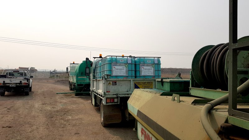 Trucks on a dirt patch