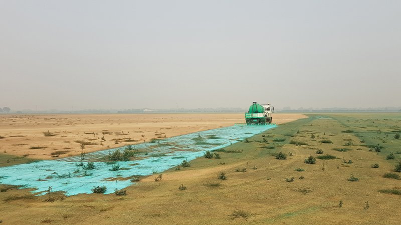 A truck applying soil stabilisation chemicals