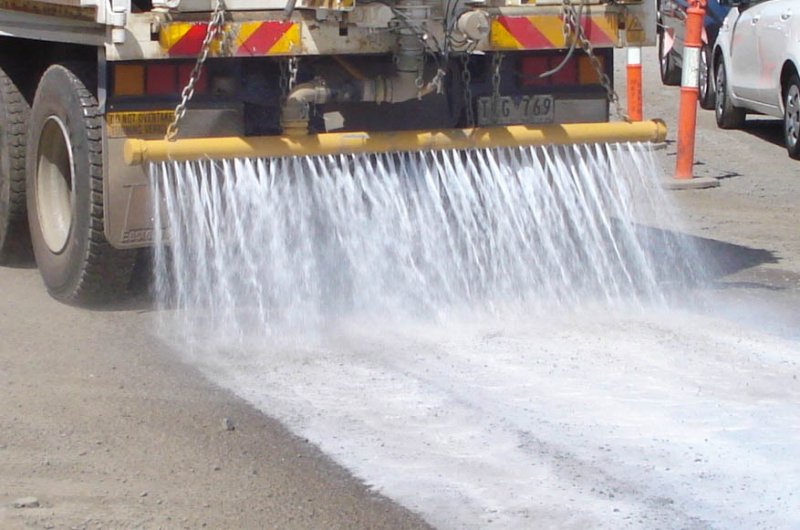 A Vital Chemical truck applying Bon-Matt HR to a road.