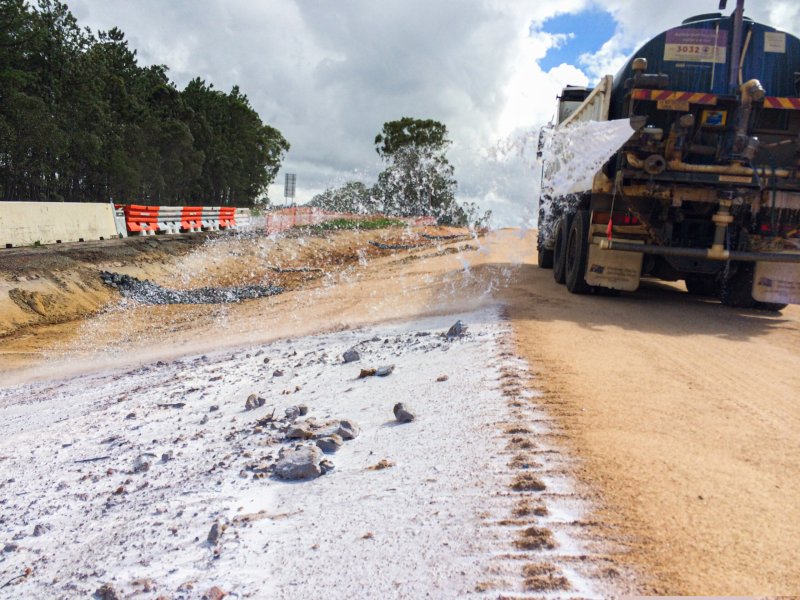 A Vital Chemical truck applying Bon-Matt HR onto the side of a road.