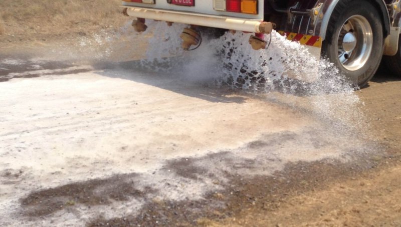 A Vital Chemical truck applying Bon-Matt HR to a road.